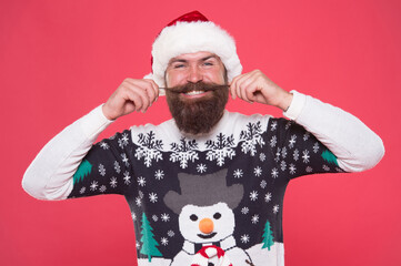 Christmas mood. new year party fun. celebrate winter holidays. merry christmas. man in funny knitted sweater. xmas shopping time. male winter fashion. happy bearded whiskered man in santa hat