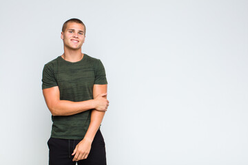 blonde  man laughing shyly and cheerfully, with a friendly and positive but insecure attitude
