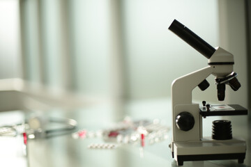 Stethoscope ampoule pill microscope on glass table