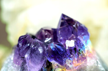 Beautiful crystal magic amethyst gem stone. Texture of specimen with scattered natural light effect.