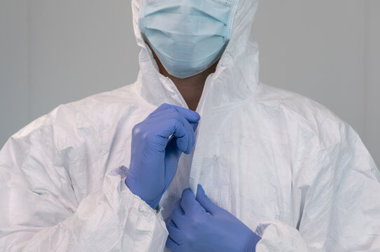 A Nurse Prepares By Putting On Protective Suit During Coronavirus Pandemic.