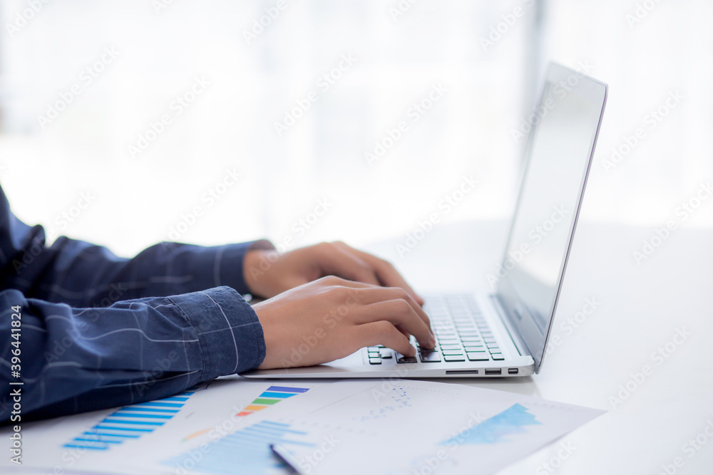 Poster hand of business man typing keyboard on laptop while document data graph and chart, marketing and in