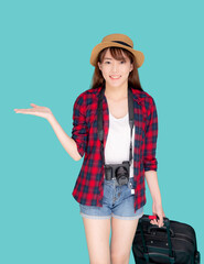 Beautiful young asian woman smiling and travel summer trip with luggage and presenting show something for abroad in vacation, asia girl having camera walking and pull suitcase for journey in holiday.