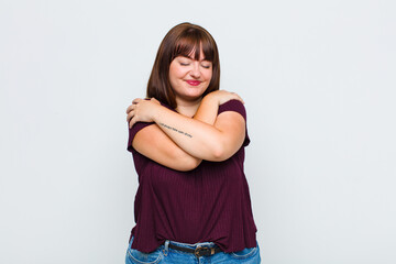 overweight woman feeling in love, smiling, cuddling and hugging self, staying single, being selfish...