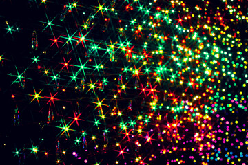 Obraz premium Sparkling LED lights on a black background in green, red and yellow