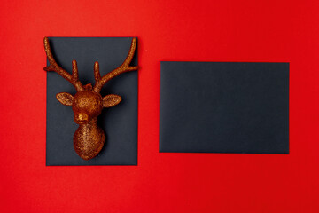 flat lay with christmas reindeer on red background