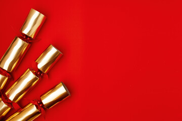 flat lay with Victorian Christmas cracker on red background