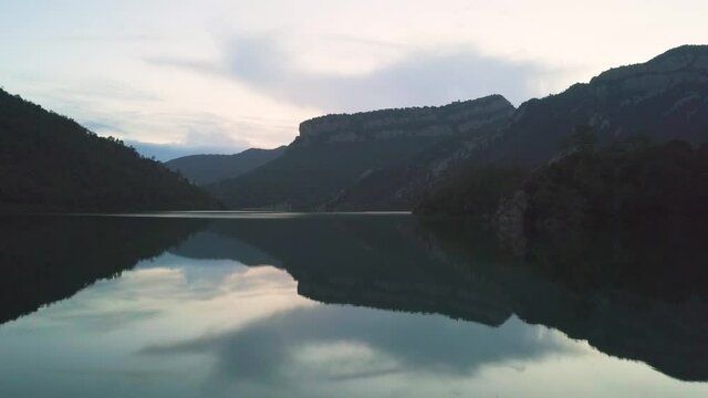 A Calm reservoir called Pantà de la Llosa del Cavall in the mountains of Spain.