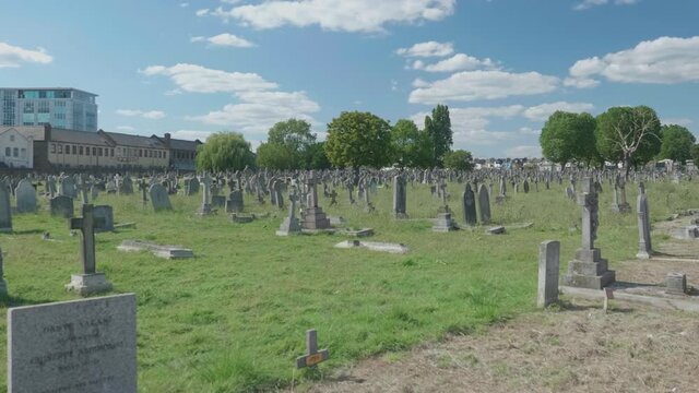 Wide shot of a cemetery with old tombstones.