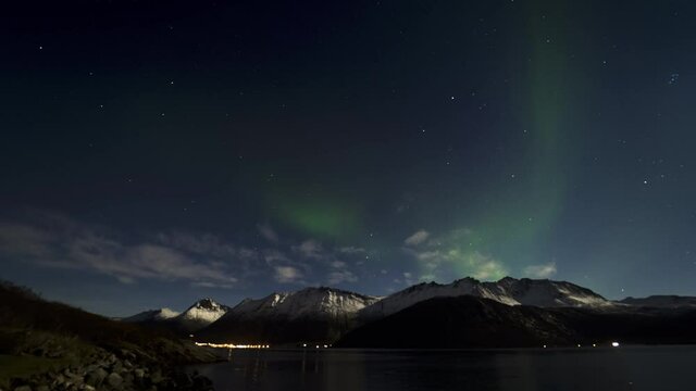 Timelapse of Northern Lights Dancing in Sky and Scenic Mountain View in Norway