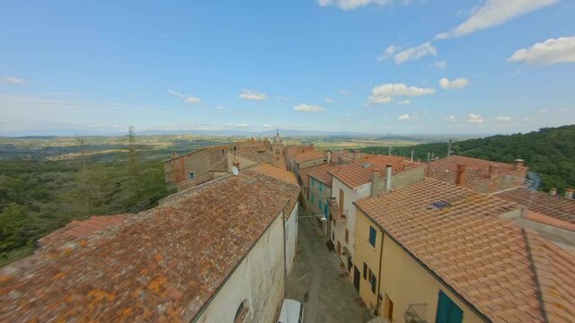 Above a typical medieval village in Tuscany, Italy. Aerial Travel concept
