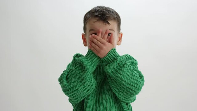 Toddler Boy Closes Eyes And Peaks Through - Funny Face - Isolated On White