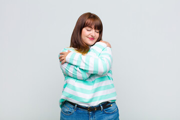 overweight woman feeling in love, smiling, cuddling and hugging self, staying single, being selfish...