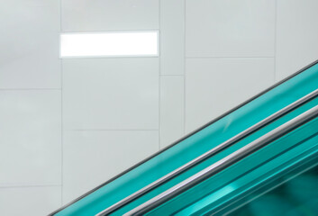 background of clean tile wall moving escalator