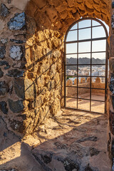 Middle East, Arabian Peninsula, Oman, Muscat, Muttrah. Sun streaming in a window at Muttrah Fort.