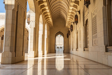 Fototapeta na wymiar Middle East, Arabian Peninsula, Oman, Muscat. Exterior corridor of Sultan Qaboos Grand Mosque in Muscat.
