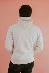 Black man in white hoodie mockup on pink background