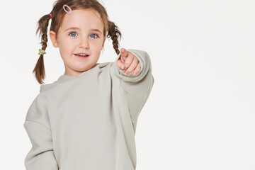 Little girl pointing to the camera