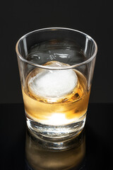 Whisky with sphere ice fancy cocktail