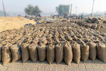 food grains filled in jute bag lying in grain market