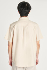 Men&#39;s beige shirt mockup minimal outfit rear view