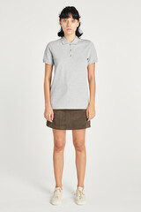 Woman wearing a skirt and a gray collared shirt mockup