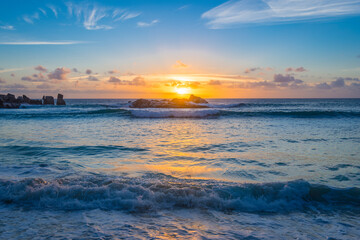 Fototapeta na wymiar Sunset on Petite Anse beach in Constance Lemuria hotel, Praslin island, Seychelles.