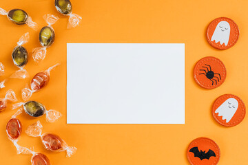 White Halloween card with copy space on an orange background