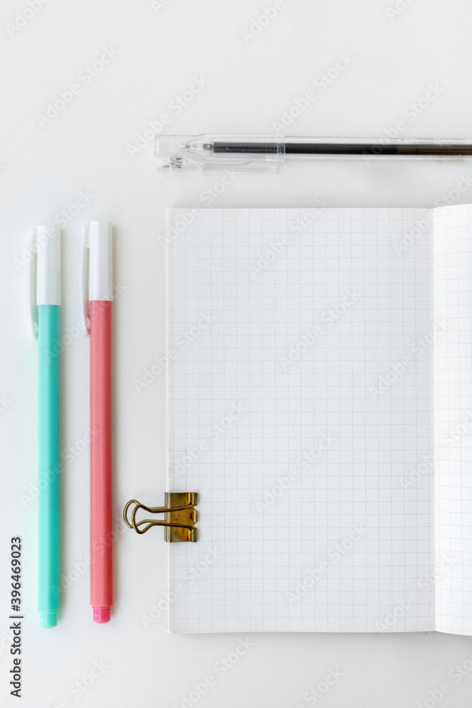 Poster grid patterned notebook page with stationary