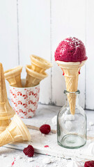 Raspberry ice cream cone in a a glass bottle