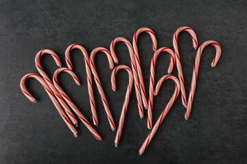 Group of Christmas Candy Canes On Dark Slate