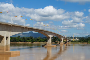 Fototapeta na wymiar Third Thai–Lao Friendship Bridge against clear blue sky and clouds at Nakhon Phanom,Thailand.