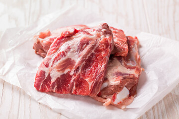 Raw spare ribs on white background