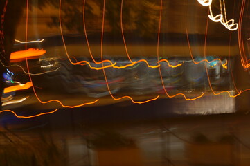 Fancy, colourful neon signs - abstract background with irregular light lines.
