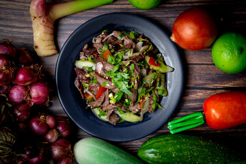 Low light food photography of spicy meat salad