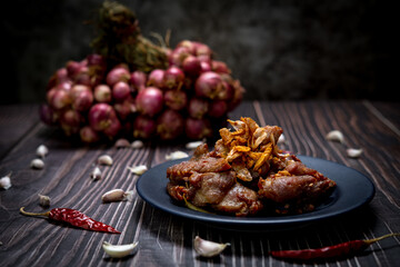 Low light photography of Pork fried with garlic ready for serve