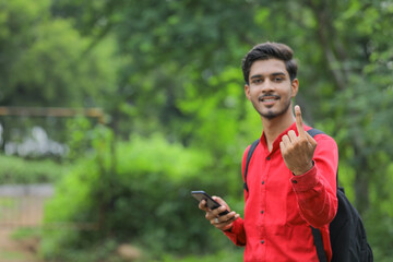 Young indian voter showing finger
