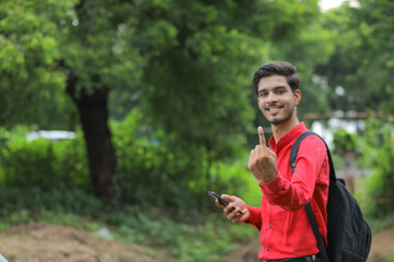 Young indian voter showing finger