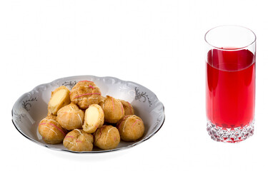 Profiteroles with cream and cranberry mors © Mikhail