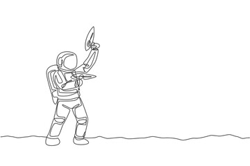 One continuous line drawing of young astronaut shoot using space laser gun to kill enemy in moon surface. Cosmic galaxy space concept. Dynamic single line draw graphic design vector illustration