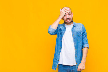 bald man panicking over a forgotten deadline, feeling stressed, having to cover up a mess or mistake