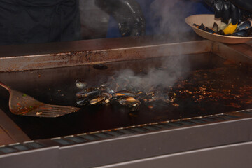 open mussels on the grill at floating market ready to eat theme