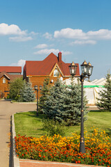 Beautifully designed landscape with flower bed and trees