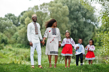Fototapeta premium African family in traditional clothes at park.