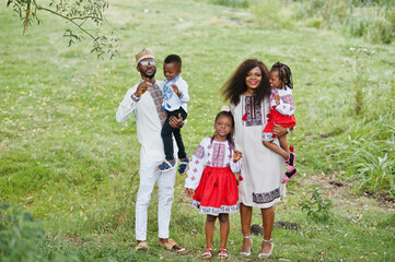 Fototapeta premium African family in traditional clothes at park.