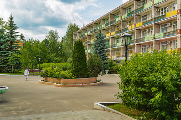 Beautifully decorated corner of nature with buildings