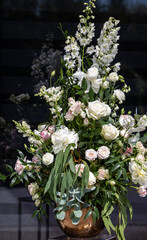 Obraz na płótnie Canvas Impressive floristic bouquet of white roses and delphinium - green twist