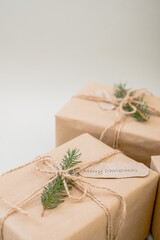 Fototapeta na wymiar Christmas zero waste. Eco friendly packaging gifts in kraft paper.minimalism. place for text. top view
