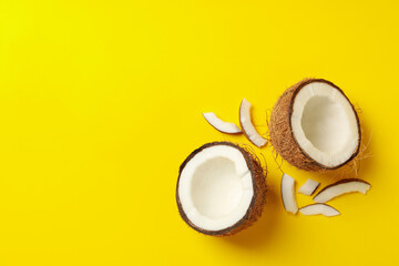 Obraz na płótnie Canvas Group of tasty fresh coconut on yellow background