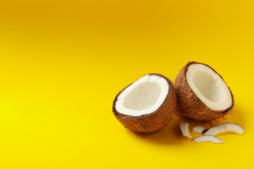 Group of tasty fresh coconut on yellow background
